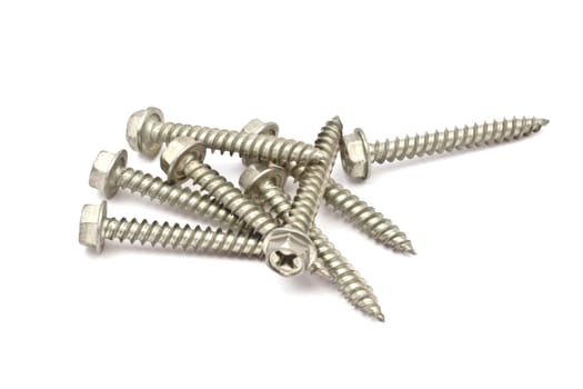Heap of screws closeup on white background