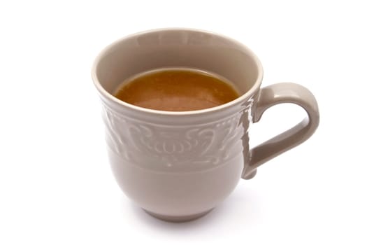 Cup of tea closeup on white background