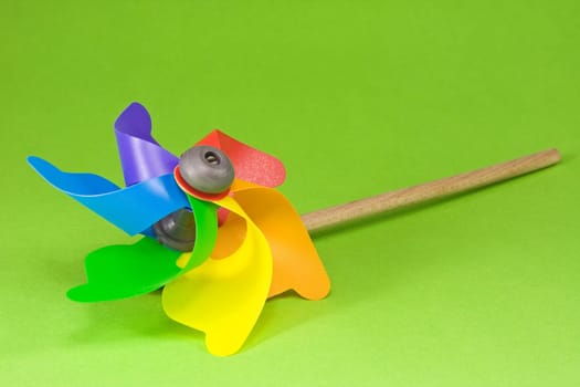 Colorful pinwheel isolated on a green background