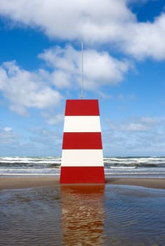 Red and White Landmark on the beach