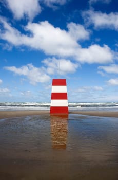 Red and White Landmark on the beach