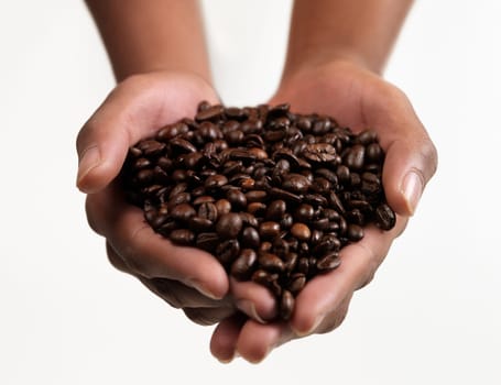 Hands holding Large group of Coffee beans