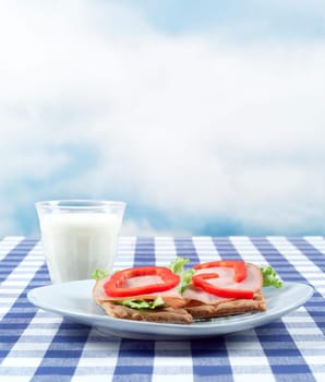 Breakfast with bread and milk on a table