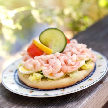 Prawn sandwich on a plate outdoor
