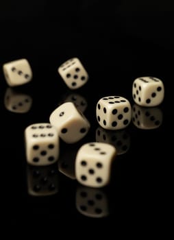 Rolled dices on black background