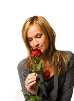 Young woman with a red rose on white background