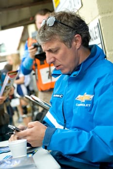Jason Plato, sending a text message during autograph signings at  the British Touring Car championships at Thruxton, UK - May 1, 2011