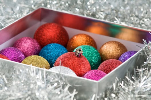 colorful christmas balls in the box close up shoot