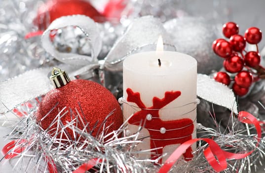 candle and christmas balls with shallow focus close up shoot