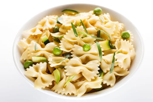 fresh pasta with peas and pumpkin isolated on white