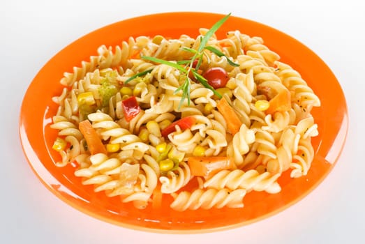 fresh pasta on orange plate close up shoot