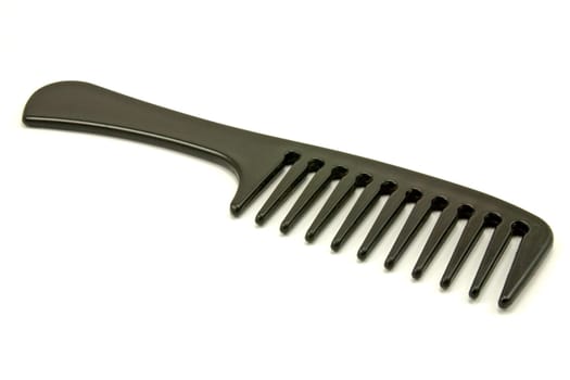 black plastic comb isolated on white background