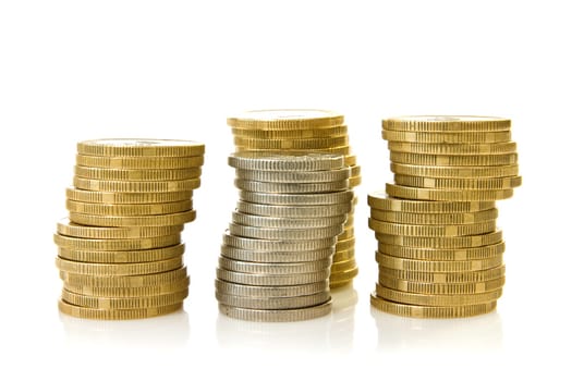 four stacks of coins over a white background