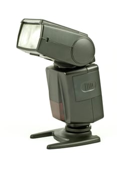 Flashgun mounted on a plate, onto white background