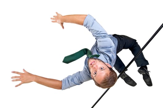 Businessman jumping over an Olympic high-jump bar