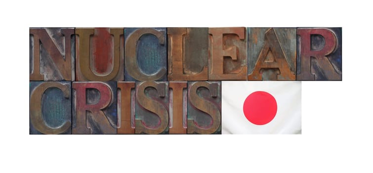 the words nuclear crisis with a Japanese flag
