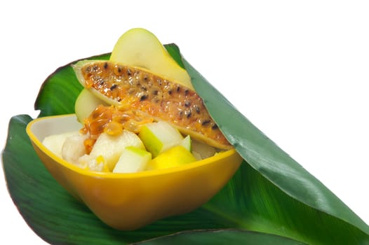 salad with tropical fruits on white background