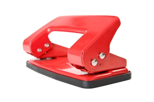 Red office paper hole puncher, isolated on white background