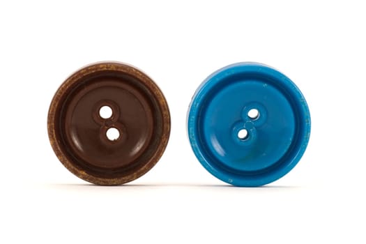 brown and blue clothes buttons ,isolated on white background