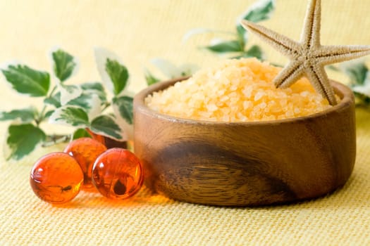 bowl of orange salt bath and oil bath pearls