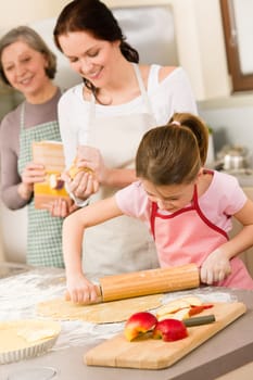 Mother and daughter making apple pie together grandmother check recipe