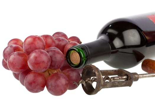 Wine bottle with corkscrew and grapes