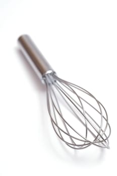 A stainless steel whisk in the kitchen