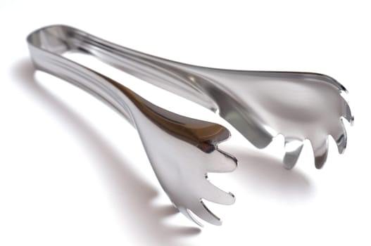 A stainless steel kitchen tongs for spaghetti
