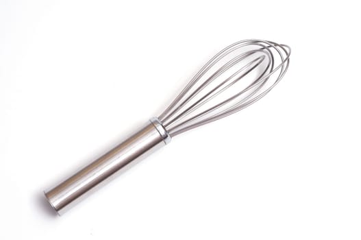 A stainless steel whisk against a white background