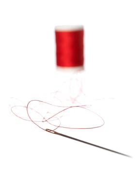 Thread Reel and nedle on white background