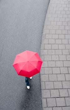 Human with red umbrella from hig Angle view