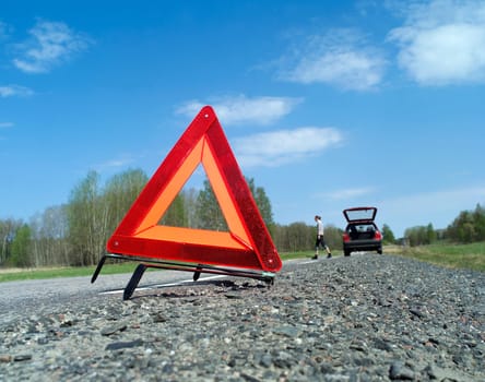 Warning traingle at the side of the road