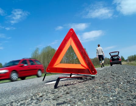 Warning traingle at the side of the road