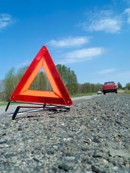 Warning traingle at the side of the road