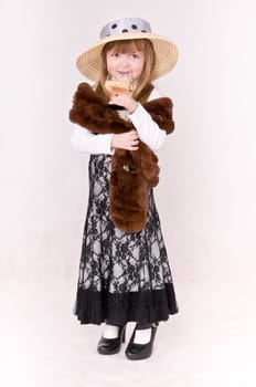 portrait little girl with drink and boa