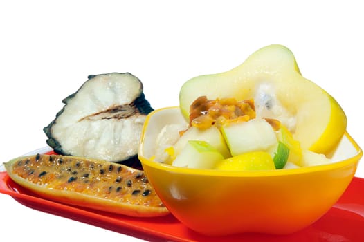 salad with tropical fruits on white background