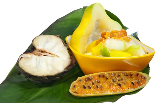 salad with tropical fruits on white background