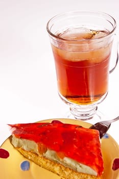 Iced tea and cake dessert with a red jelly