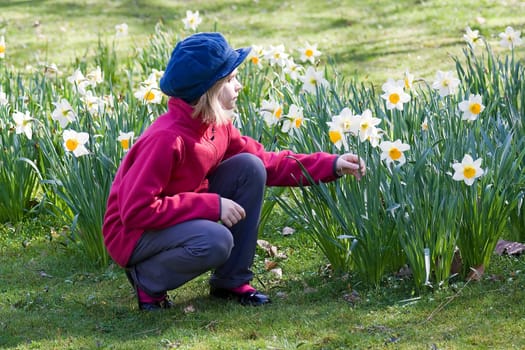 Small girl in spring garden