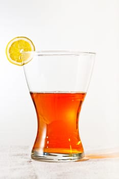 Slice of lemon at the top of the glass