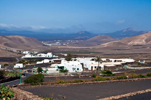 view to typical old houses in Yaiza in volcanic area, Lanzarote