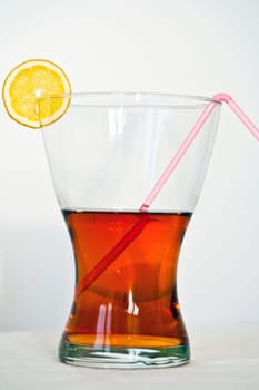 Slice of lemon at the top of the glass