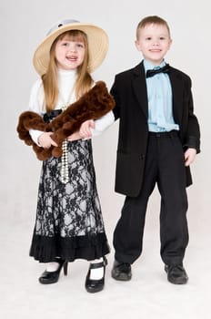 Smiling boy and girl hold each other&#039 s hand
