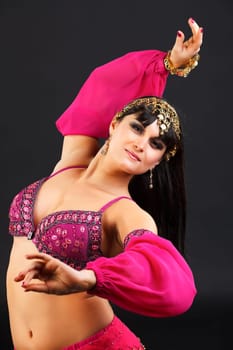 Young blonde belly dancer in pink.