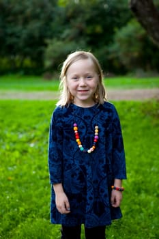 Little girl outdoors on a beautiful summer afternoon