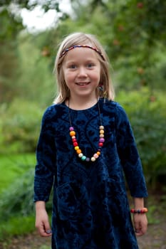 Little girl outdoors on a beautiful summer afternoon