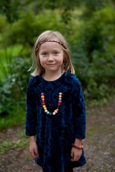 Little girl outdoors on a beautiful summer afternoon
