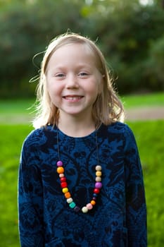 Little girl outdoors on a beautiful summer afternoon