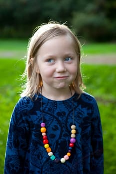 Little girl outdoors on a beautiful summer afternoon