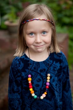 Little girl outdoors on a beautiful summer afternoon